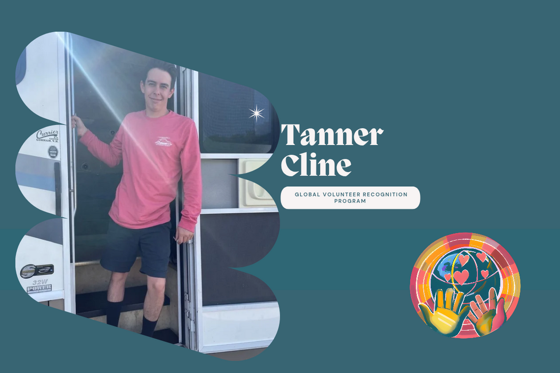 Tanner Cline Man in pink shirt and shorts standing in the doorway of a camper vehicle.