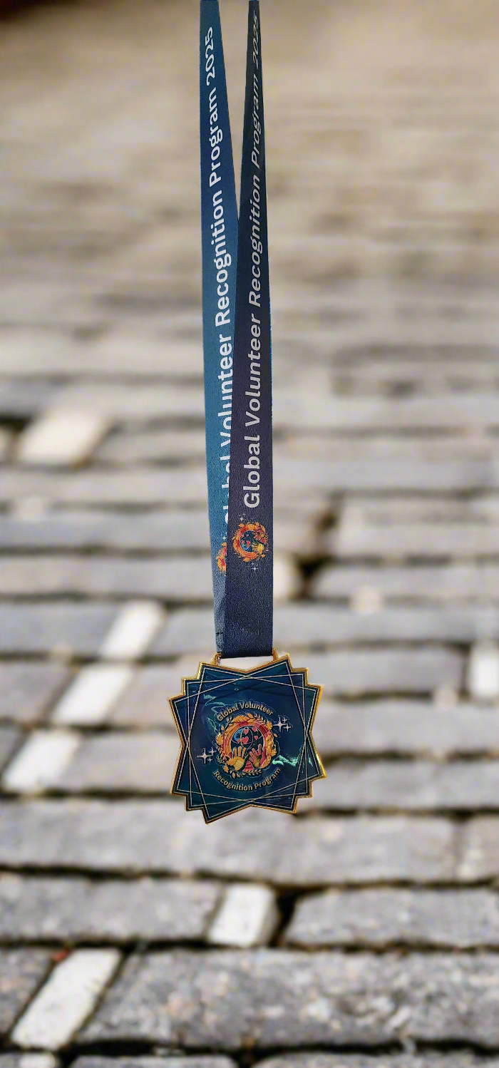 2025 Global Volunteer Recognition Program Membership Keepsake Medal with a blue ribbon on a street