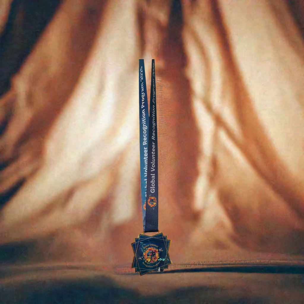 2025 Global Volunteer Recognition Program Membership Keepsake Medal with a blue ribbon on a cloth background