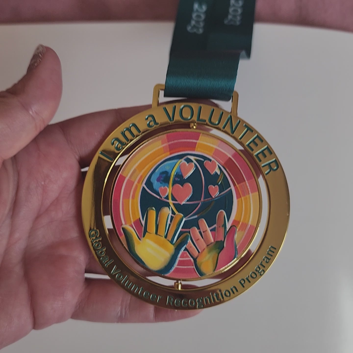 video of the medal showing that it spins