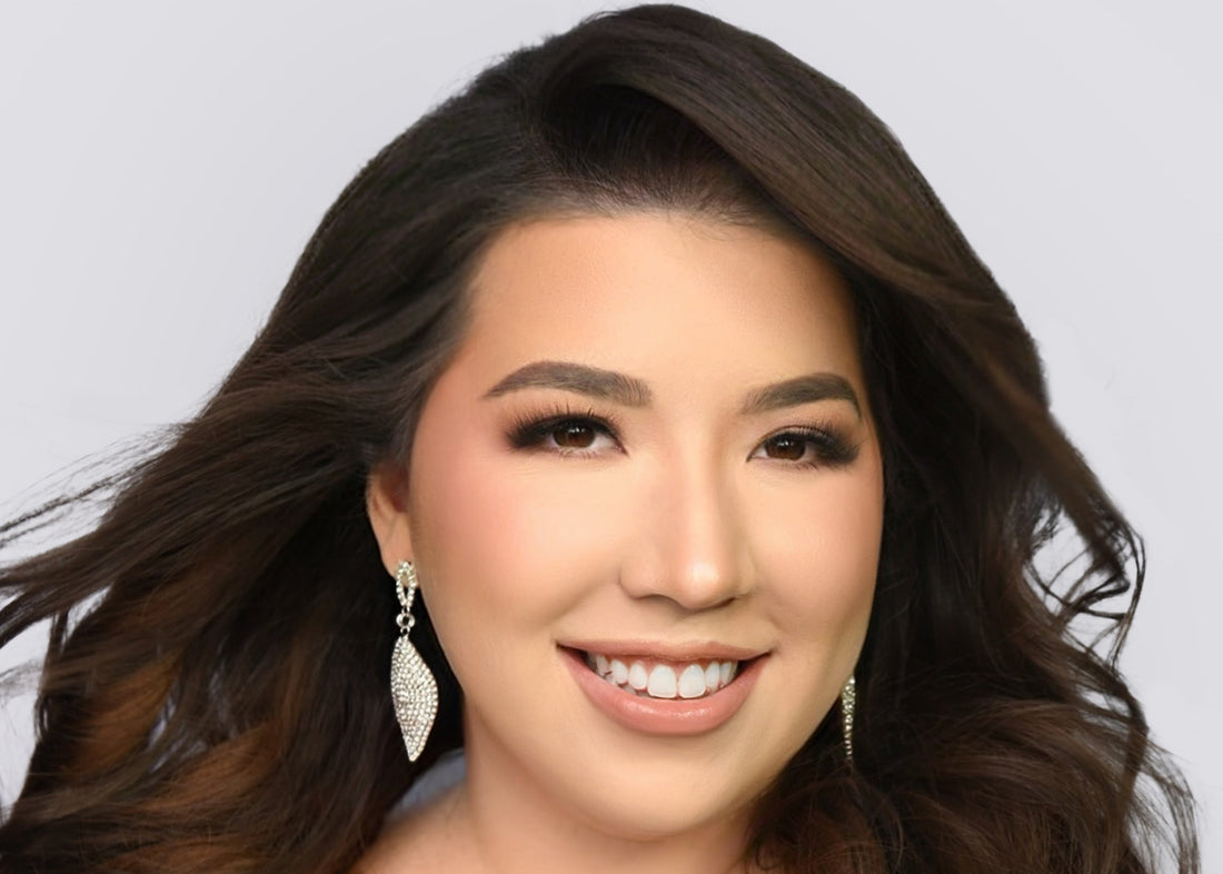 a women with longhair wearing silver earrings