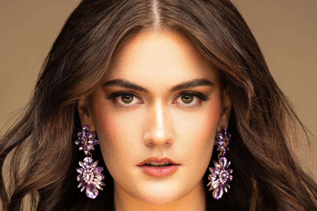 girl with long hair wearing large ear rings