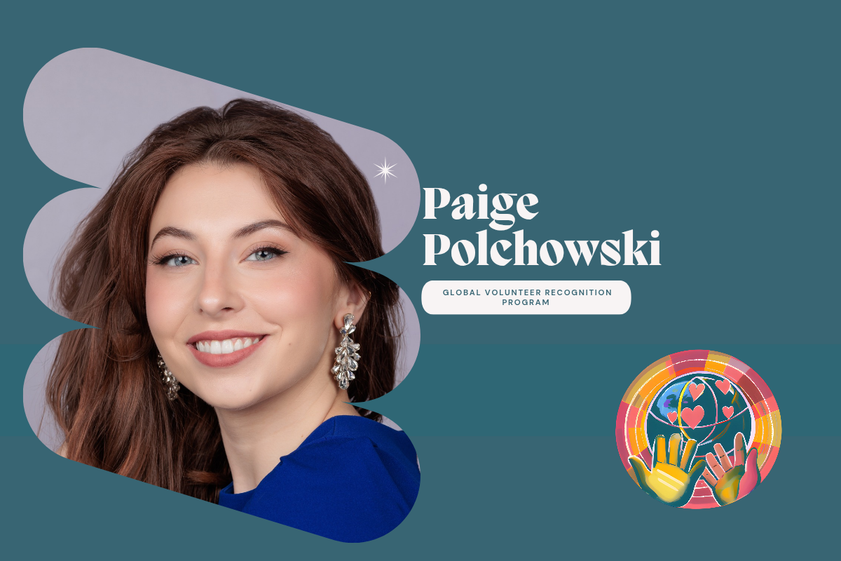 Paige Polchowski Woman with long brown hair wearing a blue top against a gray background