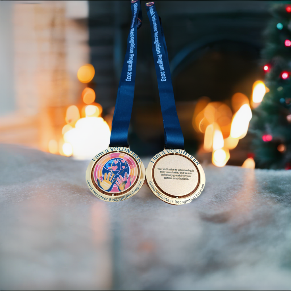 picture of spinning medal. the logo is hands giving love to the world.