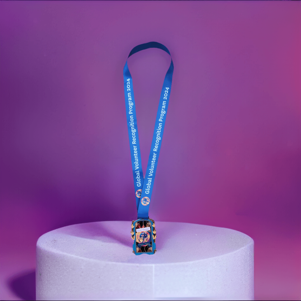 2024 Global Volunteer Recognition Program Membership Blue lanyard with a colorful badge holder 