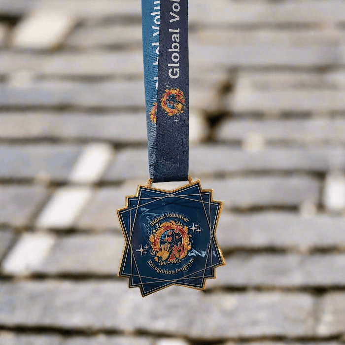 Keepsake Medal with a blue ribbon on a white background