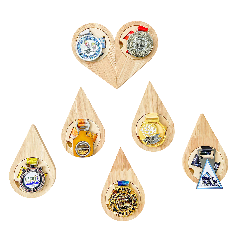 Set of wooden teardrop-shaped bottle openers with various designs on a white background