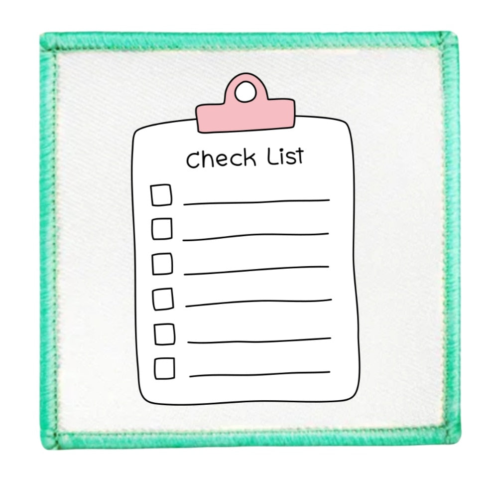 Project Planner Badge Checklist with a pink clip on a white background