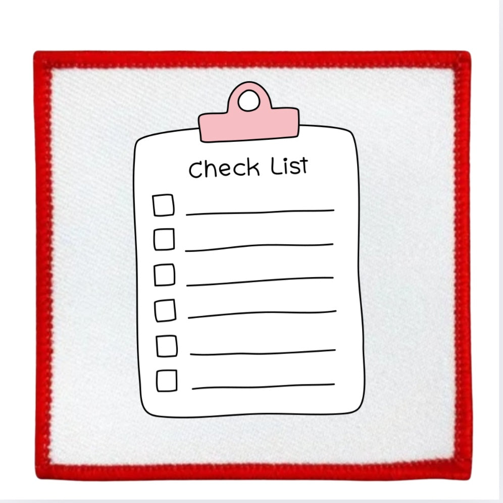 Project Planner Badge Checklist with a pink clip on a white background