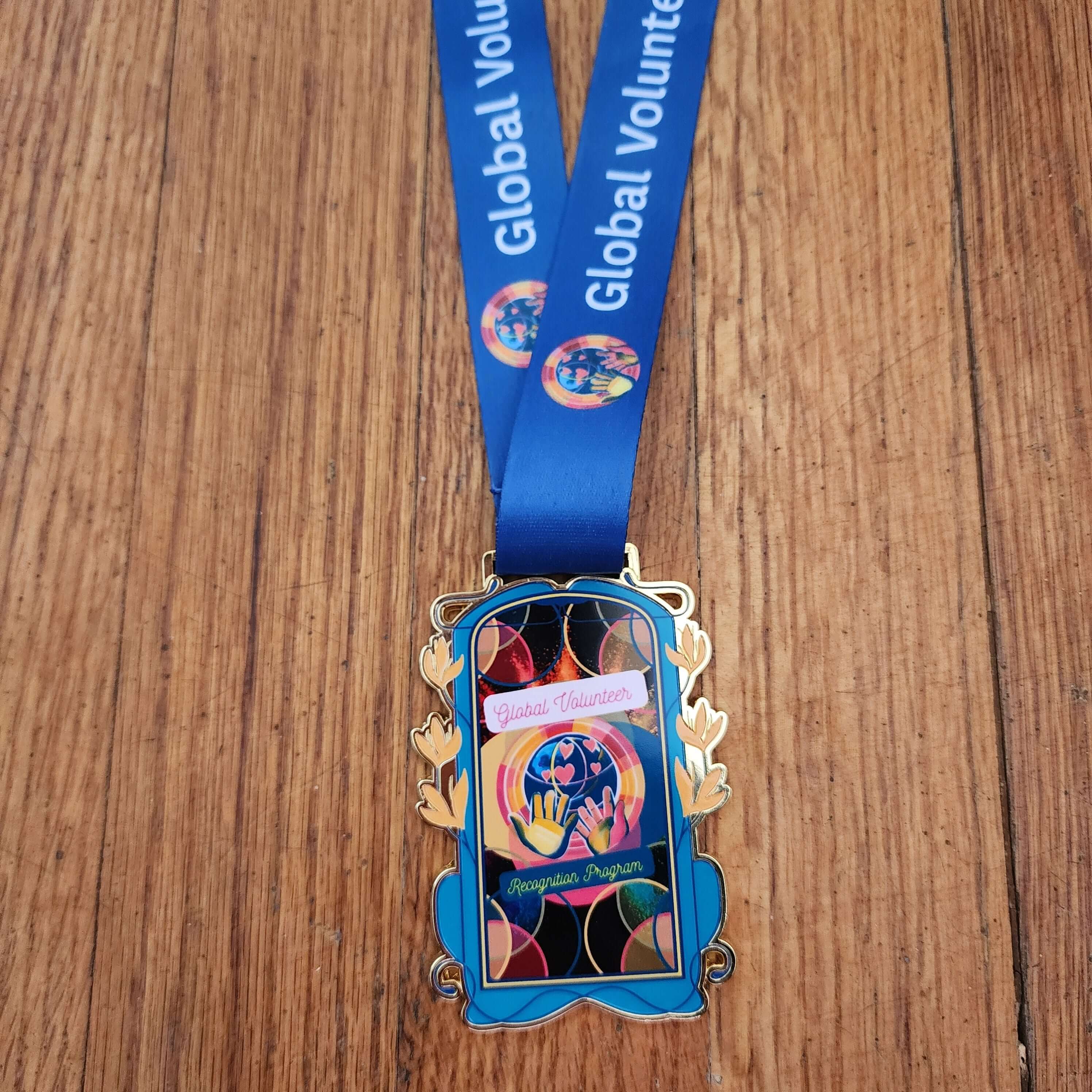 Blue lanyard with a colorful badge holder 