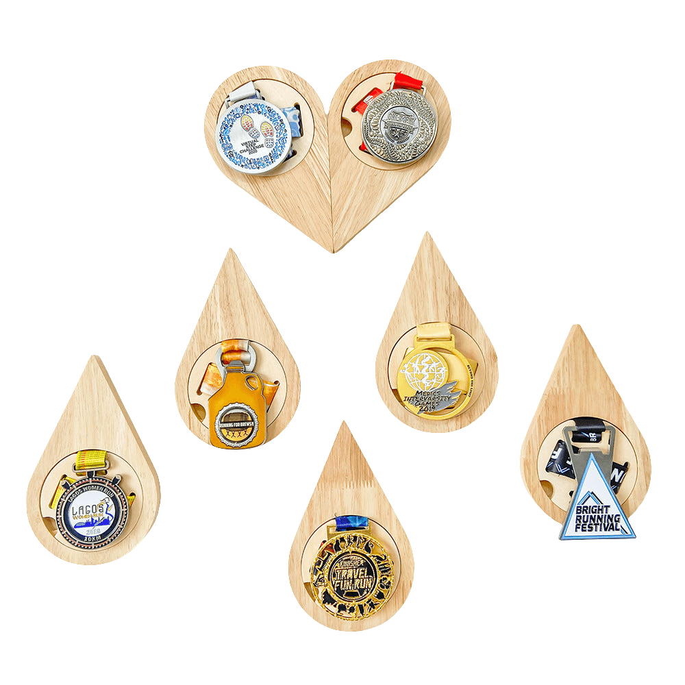 Set of wooden teardrop shaped display with various designs on a white background