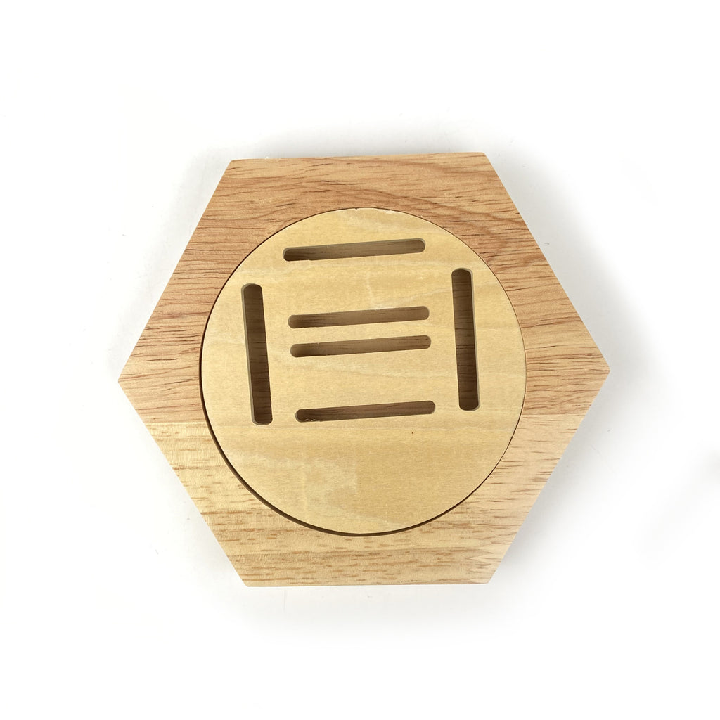 Set of wooden teardrop shaped medal display with various designs on a white background